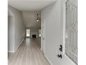 Inviting entryway featuring new floors and paint, and leading into a bright and airy living space at 2420 Walnut Grove Way, Suwanee, GA 30024