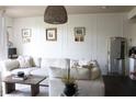 Cozy living room with decorative wall paneling, plush sofa, and stylish decor at 711 Cosmopolitan Dr # 413, Atlanta, GA 30324