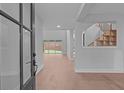 Light-filled foyer showcases an open floor plan and hardwood floors at 4830 Briscoe Dr, Cumming, GA 30028