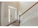 Bright entryway featuring new floors and staircase with white railings at 98 Coopers Glen Sw Dr, Mableton, GA 30126
