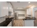 Modern kitchen featuring stainless steel appliances and granite countertops at 98 Coopers Glen Sw Dr, Mableton, GA 30126