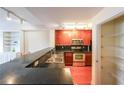Efficient kitchen layout with a breakfast bar and stainless steel appliances at 230 E Ponce De Leon Ave # 324, Decatur, GA 30030