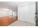 Inviting entryway with neutral tile flooring and a large closet, leading into a bright living space at 30 Dunwoody Springs Dr, Atlanta, GA 30328