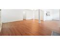 Open-concept living area with wood floors, seamlessly connecting to the kitchen, perfect for entertaining at 30 Dunwoody Springs Dr, Atlanta, GA 30328