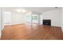 Spacious living room features warm wood floors, a fireplace, and ample natural light at 30 Dunwoody Springs Dr, Atlanta, GA 30328
