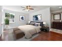Serene bedroom featuring a plush bed, hardwood floors, and an attached bath for ultimate relaxation at 30 Dunwoody Springs Dr, Atlanta, GA 30328