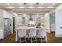Bright and airy kitchen with a large island, stainless steel appliances, and stylish pendant lighting at 175 Centennial Trce, Roswell, GA 30076