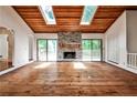 Spacious living room features hardwood floors, skylights, and a stone fireplace at 2528 Chimney Springs Dr, Marietta, GA 30062