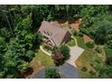 An aerial view of a stately home featuring a circular driveway, landscaped grounds, and mature trees at 17 Shotgun Nw Rd, Cartersville, GA 30121