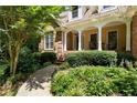 Inviting front porch area with classic columns and comfortable seating amid verdant landscaping at 17 Shotgun Nw Rd, Cartersville, GA 30121