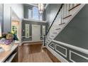Elegant foyer with a grand staircase, high ceilings, and detailed molding, creating a welcoming entrance at 2878 Wesley Heath Nw, Atlanta, GA 30327