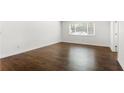 Bright bedroom showcasing hardwood floors, complemented by a window that fills the space with natural light at 115 Biscayne Nw Dr # F1, Atlanta, GA 30309