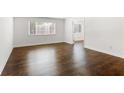 This bedroom has hardwood floors, a window, and an ensuite bathroom at 115 Biscayne Nw Dr # F1, Atlanta, GA 30309