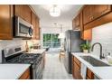 Updated kitchen with stainless steel appliances and ample counter space at 3390 Kenland Se Rd, Smyrna, GA 30082