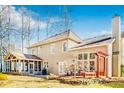 Spacious backyard featuring a screened-in porch, patio area, and lush landscaping at 380 Victorian Ln, Duluth, GA 30097