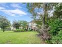Brick home featuring a meticulously maintained lawn and attractive landscaping at 10865 Glenhurst Pass, Duluth, GA 30097