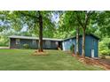 Single story home with beautiful lawn and mature trees at 30 Roseberry Dr, Stockbridge, GA 30281