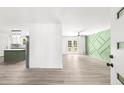 Bright and airy living room with modern floors and decorative wall feature at 30 Roseberry Dr, Stockbridge, GA 30281