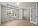 Office space with natural light, tray ceiling, and beautiful French doors at 900 Melody Ridge Ln, Buford, GA 30518