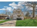 Beautiful home with a lush green lawn, long driveway, and inviting exterior architecture at 260 Westview Sw Pl, Atlanta, GA 30314