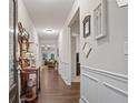Elegant hallway features hardwood floors, decorative trim, and a view into the spacious living areas at 263 Jefferson Ave, Canton, GA 30114