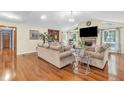 Spacious living room features hardwood floors, vaulted ceilings, and a cozy fireplace at 400 Little John Nw Dr, Lilburn, GA 30047