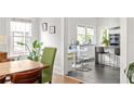 Kitchen with stainless appliances, table, chairs, and white cabinets at 307 S Mcdonough St, Decatur, GA 30030