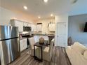 Cozy kitchen with stainless steel appliances, granite countertops, and dining area at 544 Magnolia Circle, Palmetto, GA 30268
