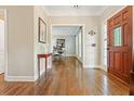 Inviting entryway with hardwood floors, wood door with glass window, and views to the office at 3267 Standing Peachtree Trl, Kennesaw, GA 30152