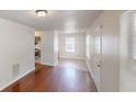 Inviting living room with hardwood floors seamlessly connecting to an adjacent kitchen space at 71 Thayer Se Ave, Atlanta, GA 30315