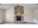Living room featuring a stunning stone fireplace with white mantle, creating a cozy focal point at 1169 Oaks Pl, Stone Mountain, GA 30083