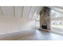Spacious living room features a stone fireplace, hardwood floors, and plenty of natural light at 366 O Brian Dr, Stone Mountain, GA 30088