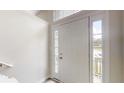 Bright foyer with a classic white front door, sidelights, and transom window at 488 Barclay Ct, Stone Mountain, GA 30083