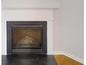 Close up of a living room fireplace with black grate at 364 Springhaven Way, Lawrenceville, GA 30046