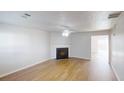 Bright living room featuring a fireplace and hardwood flooring at 364 Springhaven Way, Lawrenceville, GA 30046