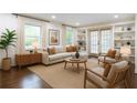Bright living room featuring a neutral sectional sofa, hardwood floors, built-in shelves, and natural light at 1393 Sagewood Cir, Stone Mountain, GA 30083