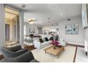Open-concept living space with balcony access, seamlessly connecting the living room, kitchen, and dining areas at 1820 Peachtree Nw St # 804, Atlanta, GA 30309