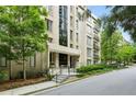 Well-maintained building featuring a landscaped entrance and mature trees surrounding the property at 2769 Peachtree Ne Rd # 7, Atlanta, GA 30305