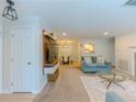 Open-concept living space featuring a modern media center, fireplace and dining area at 907 Olde Mill Ln, Norcross, GA 30093
