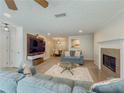 Inviting living room featuring a fireplace, media center, open to the dining area at 907 Olde Mill Ln, Norcross, GA 30093