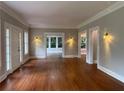 Spacious living room featuring hardwood floors, elegant trim, and natural light from multiple windows at 1098 Oakdale Ne Rd, Atlanta, GA 30307