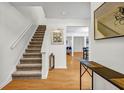 Inviting entryway showcasing hardwood floors and staircase, leading to open living spaces at 3073 Waldrop Cir, Decatur, GA 30034