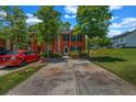 Charming brick townhouse featuring a well-maintained front yard and a cozy entrance with driveway at 3073 Waldrop Cir, Decatur, GA 30034