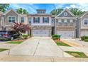 Attractive townhouse with a two-car garage and well-maintained landscaping at 5312 Brooklands Dr, Lithonia, GA 30058