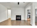 Bright living room with a fireplace and views into the adjacent kitchen area at 5312 Brooklands Dr, Lithonia, GA 30058
