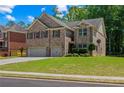 Beautiful home showcasing its brick facade, red shutters, and green lawn at 2015 Chapel Estates Lane Southeast Ln, Dacula, GA 30019