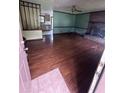 Open-concept living area with hardwood floors, fireplace and abundant light at 2169 Tiffany Ln, Lithonia, GA 30058