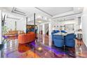 Open concept living room seamlessly integrates kitchen, dining, and living spaces with colorful artistic epoxy floors at 1231 Barnes Nw St, Atlanta, GA 30318