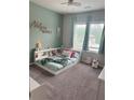 Cozy bedroom with an accent wall, carpeted floors and soft, natural light at 126 Jacobs Ln, Loganville, GA 30052