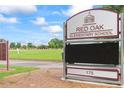 Sign for Red Oak Elementary School, featuring a modern design and welcoming appearance at 615 Brookwater Dr, Stockbridge, GA 30281
